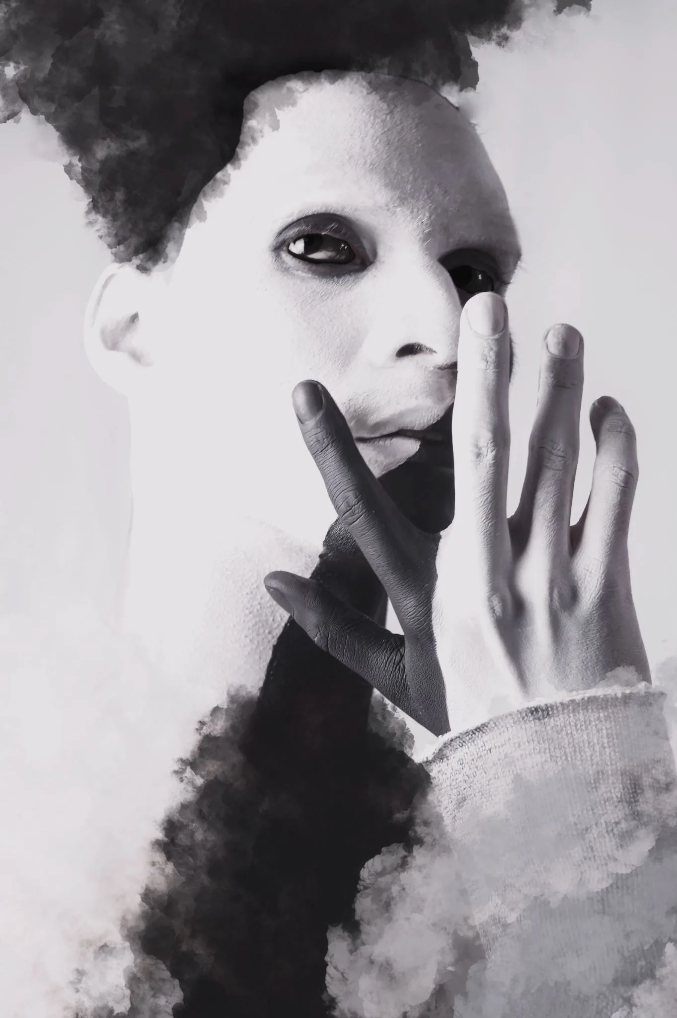 Black and white portrait with smoke covering half of the face